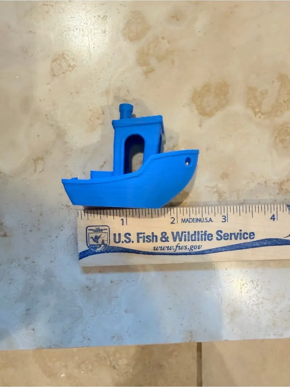 Small 3D-Printed Toy Boat in Bright Blue